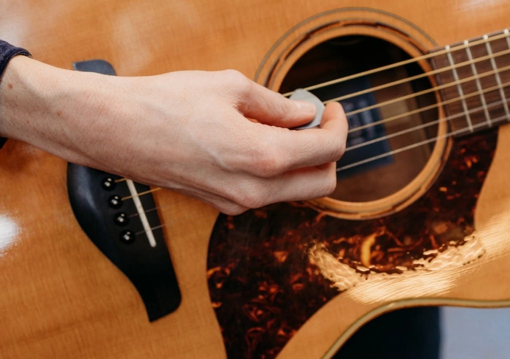 Person playing the guitar