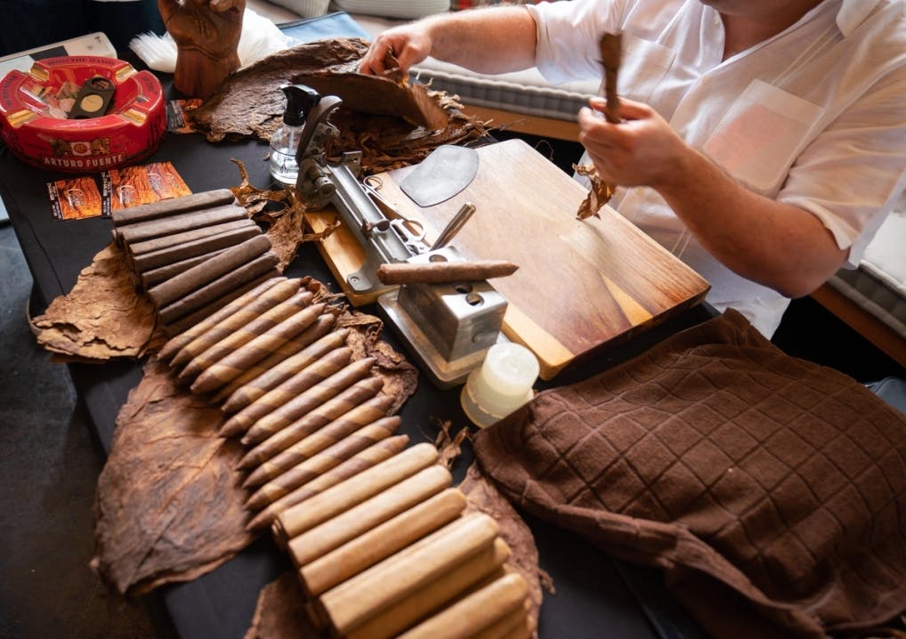 Person roling a cigar